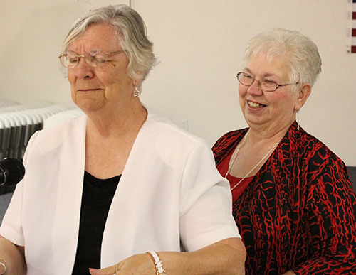 Photo by Mike Brothers Sullivan High School Alumni Who’s Who Award winner Norma Piper (Class of ’57) emotionally accepts the honor from Cindy Bruce (Class of ’65) at the annual banquet October 8.