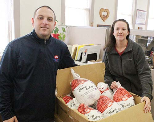 Food Pantry Thanksgiving Turkeys arrived from Sullivan IGA just in time for Thanksgiving at the Moulrie County Food Pantry. Above IGA manager Pat Stinson and pantry coordinator Kristy Dawson prepare turkeys for delivery. 