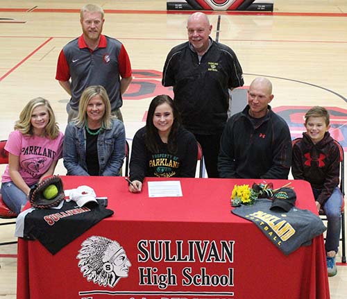 Photo by Mike Brothers Signs Letter with Parkland Sullivan Redskin softball stand out Makenzie Ruppert signed a letter of intent to play catcher in Parkland Community College softball program next season. Ruppert’s high school softball teammates attended the Nov. 22 signing ceremony at Sullivan High School gym. Pictured seated from left: sister Ema, mother Kari, Makenzie, father Shane, and brother Tristan. Standing are Sullivan coach Troy Waggoner and Parkland head coach Chuck Clutts.