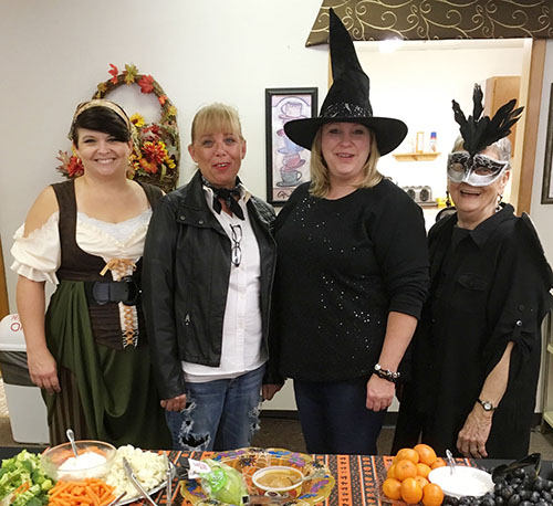 Photo by Ellen Ferrera Senior Center staff Alicia Moyer(l),Vonnie Lee, Kathi Shackles and Mary Flint preside over a groaning treat table!