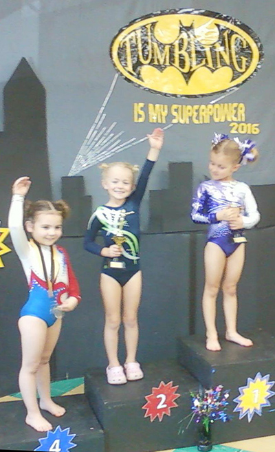 Photo furnished Tumbling Champs Sylvia Dawkins, 5, of Sullivan, pictured second from left, earned second place finish in her first tumbling meet last weekend.