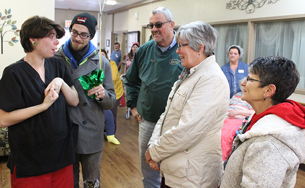 Photo by Mike Brothers Moultrie County Habitat for Humanity made the holidays happier for two families last week. Above from left: Abbie and Keegan O’Connell were surprised at Eastview Terrace with a congratulatory balloon bouquet from Habitat representatives president Gary Smith, Cheryl Thomas and Dee Ann Daily.