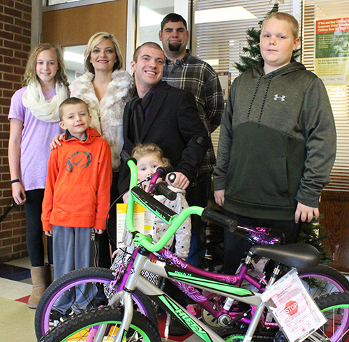 Photo by Mike Brothers Bicycle Gifts for Lovington Kids: Two bicycles were given to two Lovington elementary students Dec. 21. One boy and one girl student were selected randomly from all students enrolled. Pictured above: Winner Layna Kapp, Amanda Scroggins with son Lincoln in front, Joc French with daughter Kenzie Frye in front, winner Hunter Carnahan, and Sebastian Eckart (back). The French family has presented gift bicycles for more than 25 years, a tradition begun by Joc’s parents Mark and Tammy French.