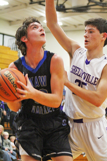 Photo by RR Best Under Pressure Timberwolves Connor Cloyd is under pressure from Shelbyville defender during the 55-32 Okaw Valley High School loss to Shelbyville December 2. 