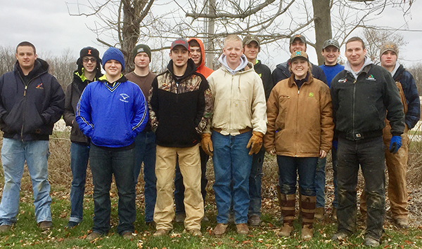 Photo furnished The Okaw Valley High School U.S. Corp of Engineers Cooperative continued last week as students planted trees as part of the environmental restoration phase. Back row left to right: Brody Bland, AnthonyWeekly, Zared Ledbetter, Matthew Buxton, Conner Cloyd, J.T. Bland, and Tanner Coleman. Front row left to right: Cody Hinkle, Cody Drake, Ethan Macklin, Jesse Robinson, Wes Wise